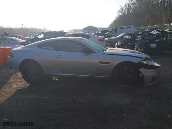 2014 Jaguar XK with VIN SAJWA4DC7EMB52199, listed as a IAAI auction lot 41191119 with 90,585 mi miles. Bid and sale history available at carsss.com. Image 13.