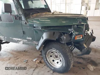 2000 Jeep Wrangler Sport with VIN 1J4FA49S8YP780104, listed as a IAAI auction lot 42095731 with Not provided miles and . Bid and sale history available at DreamBid. Image 16.
