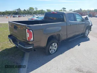 2015 GMC Canyon 2WD SLE with VIN 1GTG5BE31F1166383, listed as a IAAI auction lot 41640378 with 334,016 mi miles. Bid and sale history available at carsss.com. Image 4.