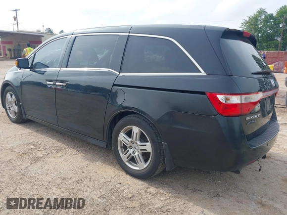 2011 Honda Odyssey Touring with VIN 5FNRL5H90BB070472, listed as a IAAI auction lot 42367710 with 203,589 mi miles and . Bid and sale history available at DreamBid. Image 3.