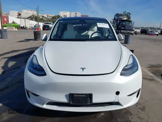 2021 Tesla Model Y Standard Range z VIN 5YJYGDED4MF162982, wystawiony jako IAAI lot #41378674 z przebiegiem 60 267 mil mil oraz . Historia ofert i sprzedaży dostępna na DreamBid. Obrazek 11.