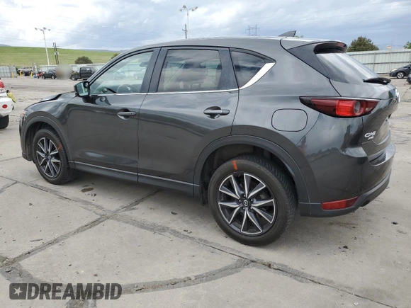 2018 Mazda CX-5 Touring z VIN JM3KFBCM4J0349687, wystawiony jako Copart lot #55857945 z przebiegiem Nie podano mil oraz Szkoda całkowita • Salvage title. Historia ofert i sprzedaży dostępna na DreamBid. Obrazek 2.