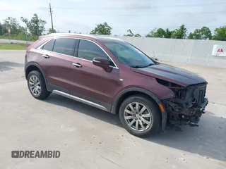 2023 Cadillac XT4 FWD Premium Luxury with VIN 1GYFZCR47PF106017, listed as a IAAI auction lot 42283401 with 40,734 mi miles and . Bid and sale history available at DreamBid. Image 1.