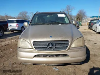 2001 Mercedes-Benz M-Class with VIN 4JGAB72E51A247926, listed as a IAAI auction lot 41277111 with 208,817 mi miles. Bid and sale history available at carsss.com. Image 12.