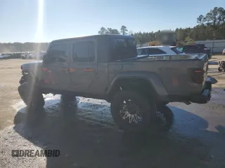2022 Jeep Gladiator Willys with VIN 1C6HJTAG7NL117102, listed as a Copart auction lot 87679075 with 28,196 mi miles and Salvage title. Bid and sale history available at DreamBid. Image 2.