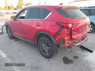 2020 Mazda CX-5 Touring z VIN JM3KFACM1L0855474, wystawiony jako IAAI lot #42004504 z przebiegiem 82 505 mil mil oraz . Historia ofert i sprzedaży dostępna na DreamBid. Obrazek 3.