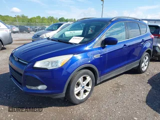 2014 Ford Escape SE with VIN 1FMCU9GX1EUB52373, listed as a IAAI auction lot 42163933 with 128,634 mi miles. Bid and sale history available at carsss.com. Image 2.