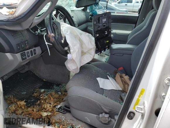 2010 Toyota Tacoma PreRunner with VIN 3TMJU4GN8AM102663, listed as a Copart auction lot 57782665 with 196,620 mi miles and Salvage title. Bid and sale history available at DreamBid. Image 7.