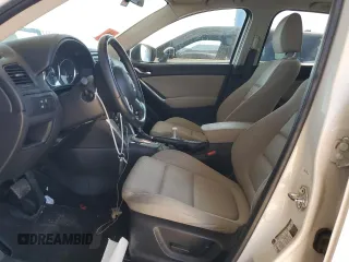 2015 Mazda CX-5 Touring with VIN JM3KE2CY2F0478167, listed as a Copart auction lot 52772805 with 135,492 mi miles and Salvage Title. Bid and sale history available at carsss.com. Image 7.