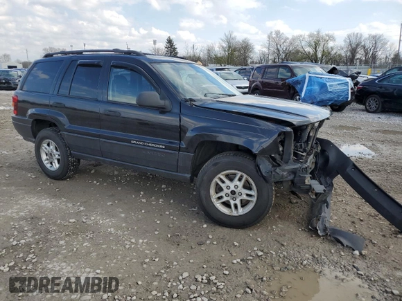 2004 Jeep Grand Cherokee Laredo with VIN 1J4GW48S84C184757, listed as a Copart auction lot 52895745 with 242,307 mi miles and Salvage Title. Bid and sale history available at carsss.com. Image 4.