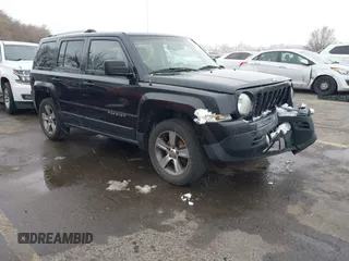 2016 Jeep Patriot Latitude with VIN 1C4NJRFB5GD545467, listed as a IAAI auction lot 41803699 with 172,398 mi miles. Bid and sale history available at carsss.com. Image 1.