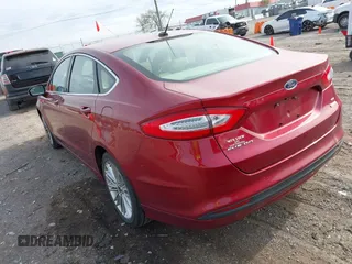 2014 Ford Fusion SE with VIN 3FA6P0HD6ER198299, listed as a IAAI auction lot 42020385 with 128,669 mi miles. Bid and sale history available at carsss.com. Image 3.