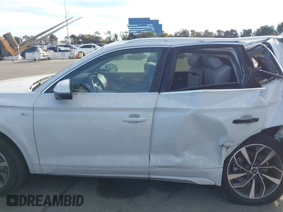 2022 Audi Q5 S line Premium z VIN WA1GAAFY3N2101201, wystawiony jako IAAI lot #41263245 z przebiegiem 28 361 mil mil oraz . Historia ofert i sprzedaży dostępna na DreamBid. Obrazek 13.