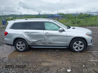 2018 Mercedes-Benz GLS 450 z VIN 4JGDF6EE1JB055629, wystawiony jako IAAI lot #42279679 z przebiegiem 61 447 mil mil oraz . Historia ofert i sprzedaży dostępna na DreamBid. Obrazek 13.
