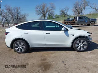 2021 Tesla Model Y Long Range with VIN 5YJYGDEE4MF122362, listed as a IAAI auction lot 42096138 with 47,006 mi miles and . Bid and sale history available at DreamBid. Image 14.