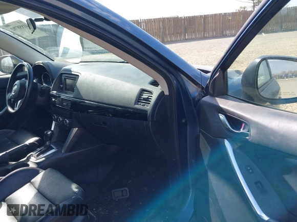 2015 Mazda CX-5 Grand Touring with VIN JM3KE4DY5F0469098, listed as a IAAI auction lot 41858792 with 174,883 mi miles. Bid and sale history available at carsss.com. Image 5.