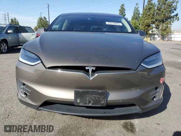 2016 Tesla Model X 70D z VIN 5YJXCBE23GF010836, wystawiony jako Copart lot #57512055 z przebiegiem 115 475 mil mil oraz Szkody całkowita. Historia ofert i sprzedaży dostępna na DreamBid. Obrazek 5.