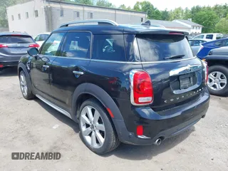 2017 MINI Countryman Cooper S z VIN WMZYT5C39H3D79798, wystawiony jako IAAI lot #42274782 z przebiegiem 96 669 mil mil oraz . Historia ofert i sprzedaży dostępna na DreamBid. Obrazek 3.