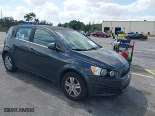 2014 Chevrolet Sonic LT with VIN 1G1JC6SB2E4115463, listed as a IAAI auction lot 42106600 with 135,652 mi miles. Bid and sale history available at carsss.com. Image 1.