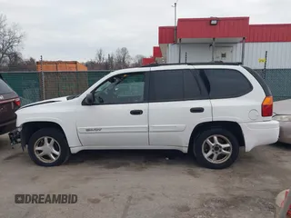 2005 GMC Envoy SLT with VIN 1GKDT13S952190876, listed as a IAAI auction lot 41308686 with 244,774 mi miles. Bid and sale history available at carsss.com. Image 15.