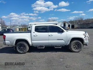 2020 Toyota Tacoma SR5 with VIN 3TMCZ5AN5LM339977, listed as a IAAI auction lot 41886937 with 94,986 mi miles and . Bid and sale history available at DreamBid. Image 13.