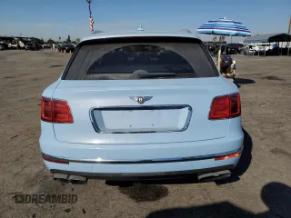 2019 Bentley Bentayga V8 z VIN SJAAM2ZV9KC026988, wystawiony jako Copart lot #73576964 z przebiegiem 31 162 mil mil oraz Szkoda całkowita • Salvage title. Historia ofert i sprzedaży dostępna na DreamBid. Obrazek 6.