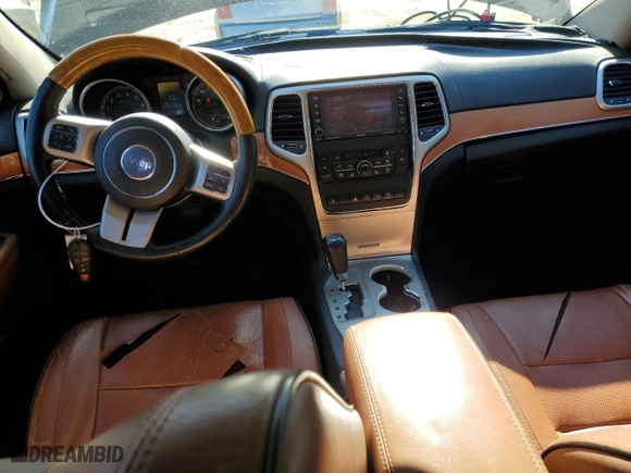 2012 Jeep Grand Cherokee Overland with VIN 1C4RJFCG0CC232021, listed as a Copart auction lot 89358695 with 129,196 mi miles and Salvage Title. Bid and sale history available at carsss.com. Image 8.