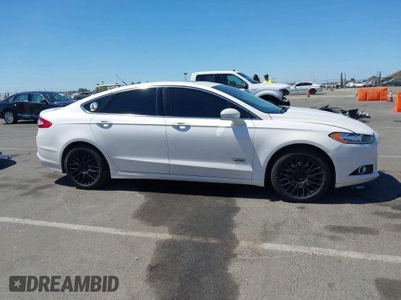 2016 Ford Fusion Titanium z VIN 3FA6P0SU2GR357508, wystawiony jako IAAI lot #42551834 z przebiegiem 177 425 mil mil oraz . Historia ofert i sprzedaży dostępna na DreamBid. Obrazek 13.