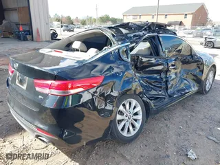 2017 Kia Optima EX with VIN 5XXGU4L33HG135421, listed as a IAAI auction lot 41738011 with 128,594 mi miles. Bid and sale history available at carsss.com. Image 4.