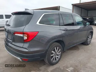 2020 Honda Pilot EX-L z VIN 5FNYF5H5XLB016632, wystawiony jako IAAI lot #41968994 z przebiegiem 75 540 mil mil oraz . Historia ofert i sprzedaży dostępna na DreamBid. Obrazek 4.