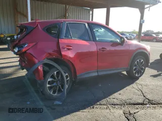 2016 Mazda CX-5 Grand Touring z VIN JM3KE4DY9G0753691, wystawiony jako Copart lot #57361645 z przebiegiem 90 733 mil mil oraz Szkoda całkowita • Salvage title. Historia ofert i sprzedaży dostępna na DreamBid. Obrazek 3.