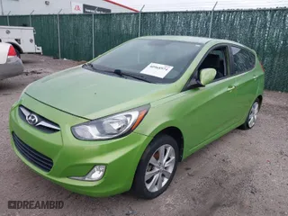 2013 Hyundai Accent SE with VIN KMHCU5AEXDU069586, listed as a IAAI auction lot 40968974 with 98,939 mi miles. Bid and sale history available at carsss.com. Image 2.