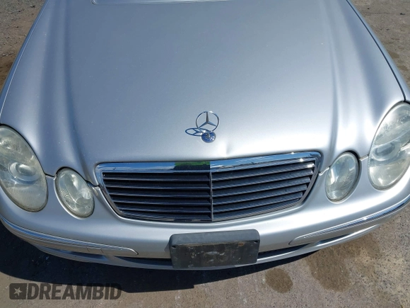 2005 Mercedes-Benz E-Class 3.2L with VIN WDBUF65J15A669561, listed as a IAAI auction lot 41888887 with 87,317 mi miles. Bid and sale history available at carsss.com. Image 6.
