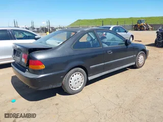 1997 Honda Civic DX with VIN 1HGEJ6120VL048384, listed as a IAAI auction lot 41866628 with 286,599 mi miles. Bid and sale history available at carsss.com. Image 4.
