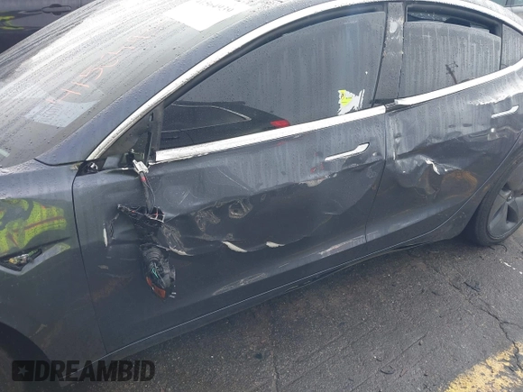 2019 Tesla Model 3 Mid Range with VIN 5YJ3E1EA3KF426971, listed as a IAAI auction lot 41564939 with Not Provided miles and . Bid and sale history available at carsss.com. Image 6.