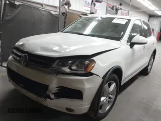 2012 Volkswagen Touareg Sport with VIN WVGFK9BP2CD002991, listed as a IAAI auction lot 42077523 with 94,515 mi miles and . Bid and sale history available at DreamBid. Image 17.