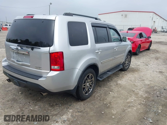 2014 Honda Pilot Touring with VIN 5FNYF4H91EB011934, listed as a IAAI auction lot 41929415 with 227,343 mi miles and . Bid and sale history available at DreamBid. Image 4.