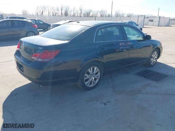 2009 Toyota Avalon XL with VIN 4T1BK36B89U335604, listed as a IAAI auction lot 41328877 with 166,396 mi miles. Bid and sale history available at carsss.com. Image 4.