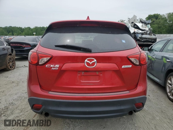 2014 Mazda CX-5 Touring z VIN JM3KE4CY3E0382106, wystawiony jako Copart lot #55521645 z przebiegiem 84 539 mil mil oraz Szkoda całkowita • Salvage title. Historia ofert i sprzedaży dostępna na DreamBid. Obrazek 6.