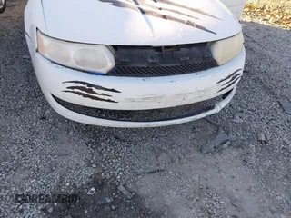 2004 Saturn ION with VIN 1G8AJ52F64Z123281, listed as a IAAI auction lot 41658784 with 206,663 mi miles. Bid and sale history available at carsss.com. Image 6.