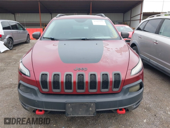 2015 Jeep Cherokee Trailhawk with VIN 1C4PJMBS6FW575517, listed as a IAAI auction lot 42661199 with 299,166 mi miles and . Bid and sale history available at DreamBid. Image 12.