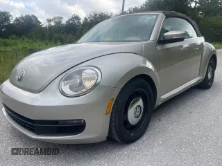 2013 Volkswagen Beetle 2.5L with VIN 3VW5X7AT2DM825928, listed as a Copart auction lot 66500855 with 48,795 mi miles and Salvage title. Bid and sale history available at DreamBid. Image 2.