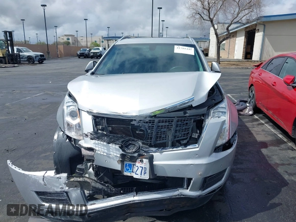 2016 Cadillac SRX Luxury Collection z VIN 3GYFNBE38GS520891, wystawiony jako IAAI lot #41781445 z przebiegiem 52 202 mil mil oraz . Historia ofert i sprzedaży dostępna na DreamBid. Obrazek 13.