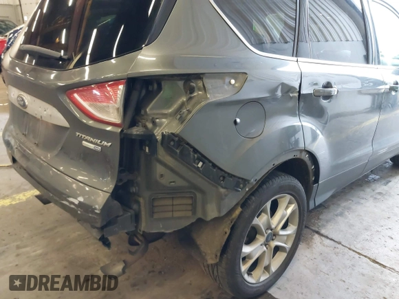 2016 Ford Escape Titanium with VIN 1FMCU9J92GUB63525, listed as a IAAI auction lot 41469824 with 156,773 mi miles. Bid and sale history available at carsss.com. Image 19.