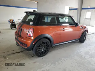 2013 MINI Hardtop S with VIN WMWSV3C52DT396176, listed as a Copart auction lot 59207165 with 104,194 mi miles and Salvage title. Bid and sale history available at DreamBid. Image 3.