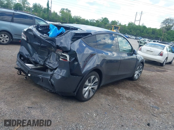 2021 Tesla Model Y Long Range z VIN 5YJYGDEE6MF070068, wystawiony jako IAAI lot #42224634 z przebiegiem 33 850 mil mil oraz . Historia ofert i sprzedaży dostępna na DreamBid. Obrazek 4.
