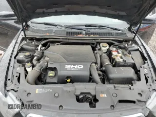 2015 Ford Taurus SHO z VIN 1FAHP2KT2FG182307, wystawiony jako Copart lot #52596525 z przebiegiem 68 214 mil mil oraz Szkoda całkowita • Salvage title. Historia ofert i sprzedaży dostępna na DreamBid. Obrazek 12.