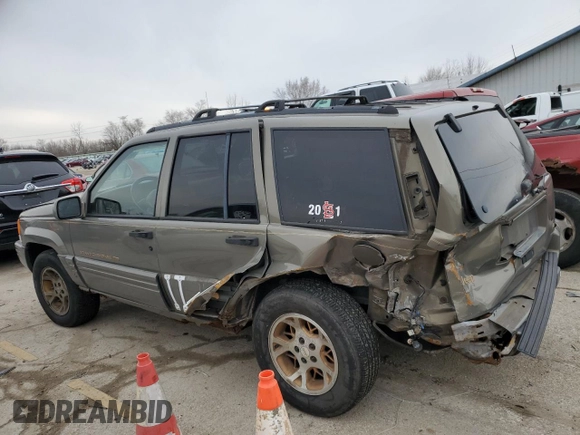 1997 Jeep Grand Cherokee Limited with VIN 1J4GZ78Y3VC568413, listed as a Copart auction lot 86171124 with 104,558 mi miles and Salvage Title. Bid and sale history available at carsss.com. Image 2.