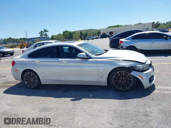 2015 BMW 4 Series 428i with VIN WBA4A5C58FGK15335, listed as a IAAI auction lot 41723243 with 152,652 mi miles and . Bid and sale history available at DreamBid. Image 12.