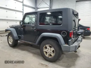 2009 Jeep Wrangler Rubicon with VIN 1J4GA64159L770895, listed as a Copart auction lot 82140864 with 209,464 mi miles and Salvage Title. Bid and sale history available at DreamBid. Image 2.